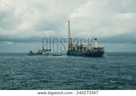 Dp Operations Near Fpso Tanker. Supply Fleet Job, Dsv Diving Support Vessel Is Approaching. Crewboat