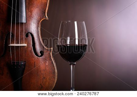 Violin Waist Detail With Glass Of Red Wine