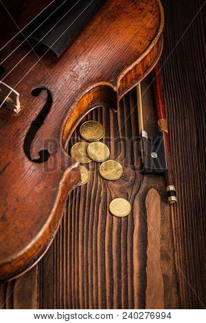 Violin Waist Detail With Bow On Rustic Wooden Background