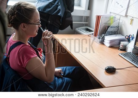 Bogandinskiy, Russia - April 20, 2018: Stekloteh Factory On Bottles Production. Female Engineer Work