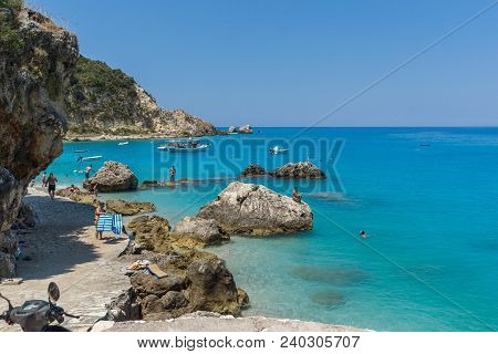 Agios Nikitas, Lefkada, Greece - July 16, 2014: Tourists Visiting Beach Of Village Of Agios Nikitas,