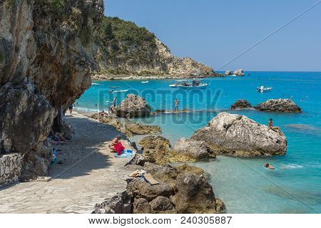 Agios Nikitas, Lefkada, Greece - July 16, 2014: Tourists Visiting Beach Of Village Of Agios Nikitas,
