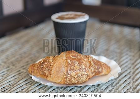 Coffee To Go In A Paper Cup With Croissants On Wooden Table, . Coffee To Go In A Paper Cup With Croi