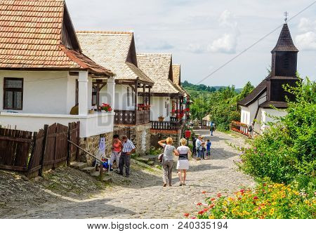 Visitors Stroll Along The Kossuth Street In The Unesco World Heritage Village - Holloko, Hungary, 13