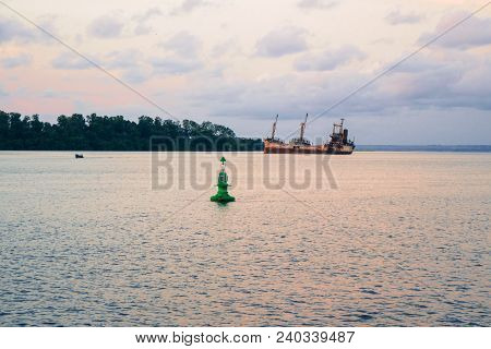 An Old Shipwreck Or Abandoned Vessel Aground Standing On The Bottom, Metal Rusty Scrap In The Fairwa