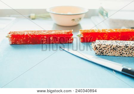 Professional Chef, Chef The Process Of Making Sushi Rolls, Spins Bamboo Mat And Cut Slices