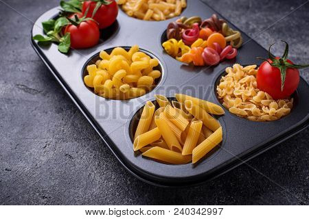 Various Type Of Pasta And Cherry Tomato. Top View