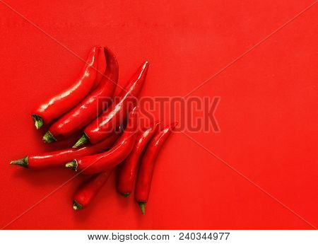 Cofred Hot Pepper On Red Plain Background