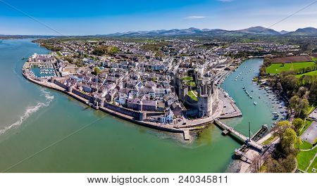Aerial View Of The Skyline Of Caernafon With The Historic Castle, Gwynedd In Wales - United Kingdom.