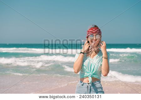 Young Woman Resting On The Sand Beach And Taking Photo With Mobail Phone