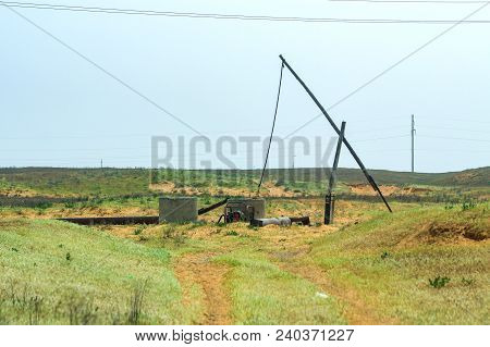 Old Sweep Well And Shadoof In Steppe.
