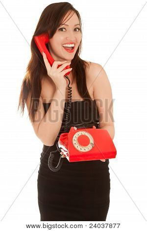 Schöne Frau mit alten roten Telefon sprechen