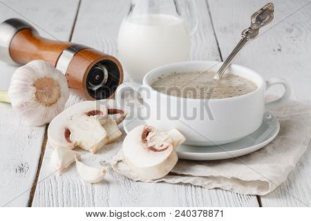 Creamy Mushroom Soup On White Wooden Table