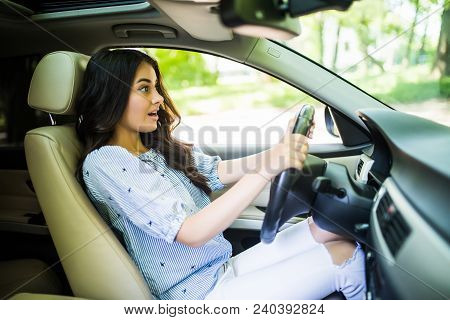 Young Frightened Driver Woman Squealing Brakes Avoiding An Accident.