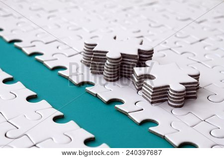 The Blue Path Is Laid On The Platform Of A White Folded Jigsaw Puzzle. The Missing Elements Of The P