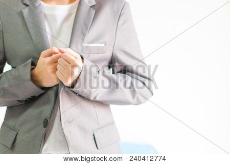Businessman In Casual Suit Grasp Tabs Of Suit Together Gesturing Ready For Competition.
