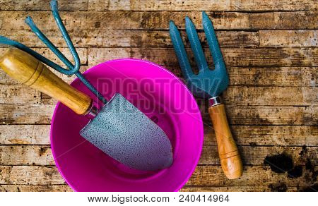 Gardening Tools On A Wooden Table Top View