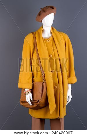 Women Stylish Beret And Handbag. Female Mannequin With Modern Leather Handbag And Yellow Cashmere To