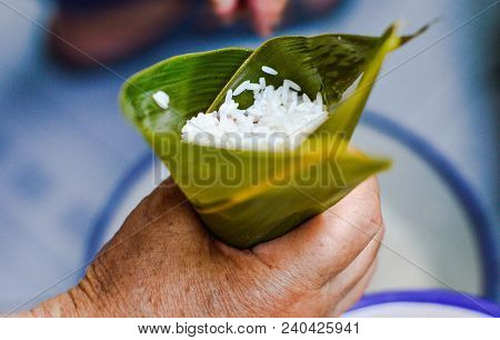 Chinese Making Zongzi. Hand Holding Leaf Filled By Sticky Rice. Zongzi, Traditional Chinese Rice Dum