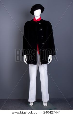 Black Hat, Coat And White Women Trousers. Mannequin Dressed In Black Women Topcoat And White Pants. 