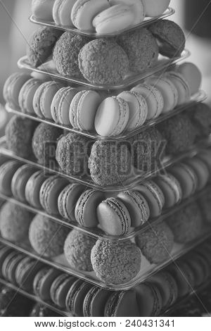 Many Colorful Traditional French Sweet Cookies Of Macaron Yellow Orange Pink Red Violet Green And Br