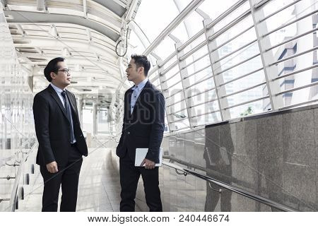 Two Business Talking With Partner About Business And Invetment  On Way To Office