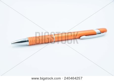 Orange Pencil With Silver Top On White Background