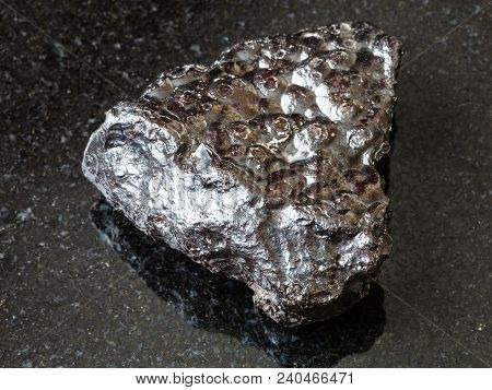 Macro Shooting Of Natural Rock Specimen - Piece Of Hematite (kidney Ore) Stone On Black Granite Back