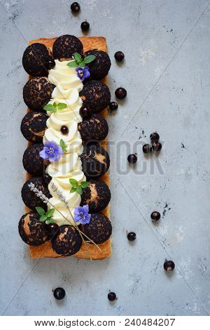 Cake Of Saint-onore From Puff Pastry, Profiteroles, Currant Cream And Whipped Cream. Classic French 