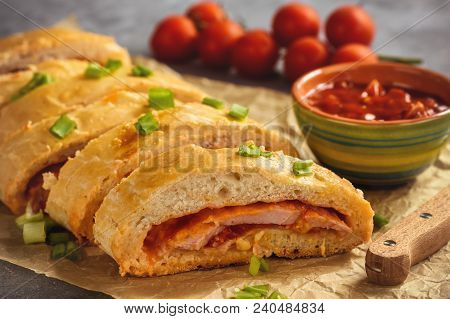 Ham And Cheese Stromboli, Italian Cuisine, On Grey Background.