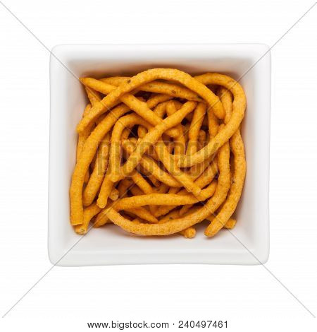 Pieces Of Muruku In A Square Bowl Isolated On White Background