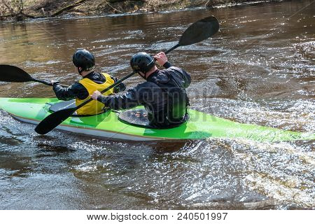 Grodno, Belarus - April, 2018: Kayak Freestyle Competition On Fast Cold Water River Strenuously Rowi