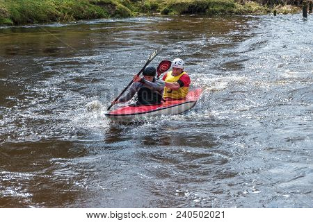 Grodno, Belarus - April, 2018: Kayak Freestyle Competition On Fast Cold Water River Strenuously Rowi