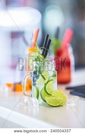 Various Lemonades In Mason Jars With Orange Lime Lemon Otange Strawberries And Fresh Fruit Fruits