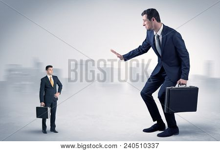 Giant businessman being afraid of small serious executor with suitcase