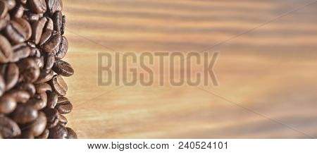 Coffee Beans On A Light Brown Wooden Background. Located On The Left Side. Large Size, Billboard, Ba