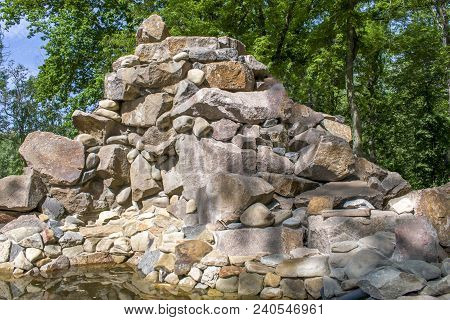 Peaceful And Peaceful Nature Of The Beautiful Stream. Wet Stones With Bright Sunlight