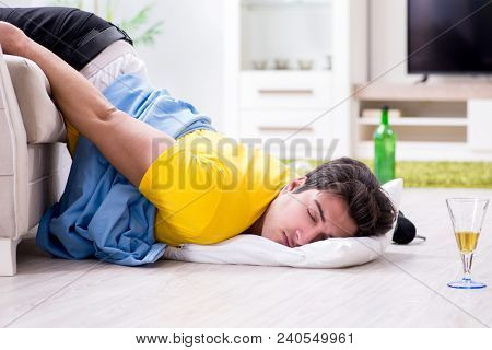 Man with mess at home after house party