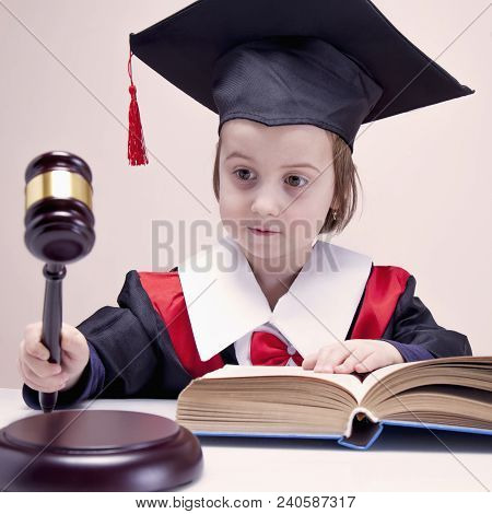 One Law For All Concept. Humorous Photo Of Child Girl Judge (lawyer).