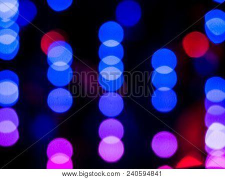 Abstract Pattern Of Colour Blurred Bokeh Neon Lights At Night Club