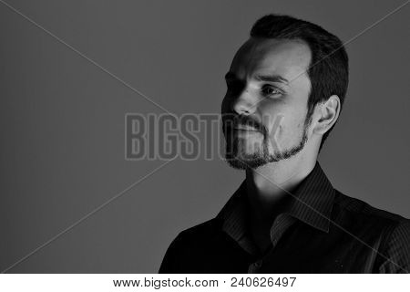 Face Of Handsome Man With Fashionable Hairstyle Half Closed In Shadow