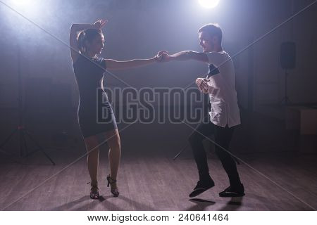 Young Couple Dancing Social Danse Kizomba Or Bachata Or Semba Or Taraxia In Dancing Class Background