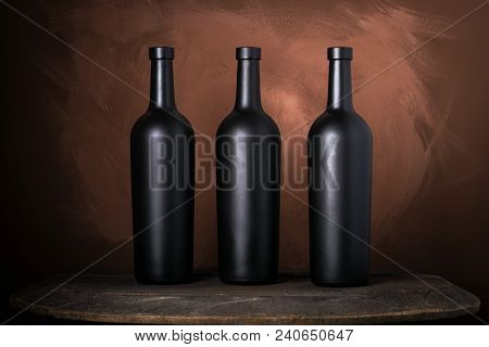 Red Wine Bottle On A Wooden Brown Background