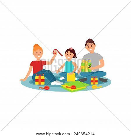 Happy Family Preparing Gifts For Holiday. Mom, Dad And Their Little Daughter Sitting On Carpet. Boxe