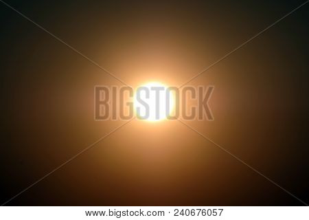 A Bright Sun Or Moon In The Center On A Dark Sky. Designer Background