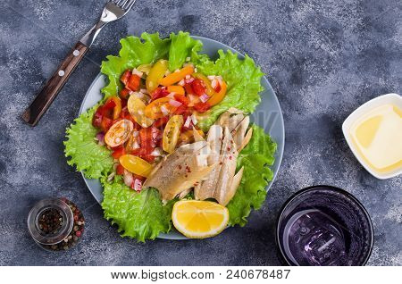 Fish Fillet With Raw Vegetables And Lemon In A Dish On The Table. Selective Focus.
