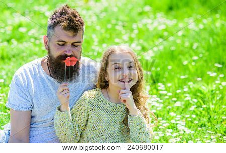 Family Spend Leisure Outdoors. Dad And Daughter Sits On Grass At Grassplot, Green Background. Child 