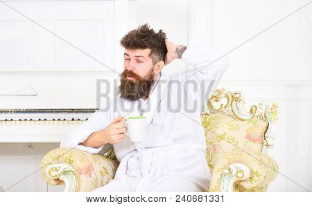 Man With Beard And Mustache Enjoys Morning While Sitting On Old Fashioned Luxury Armchair. Man Sleep
