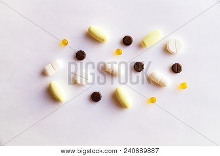 Assorted Pills And Capsules In Medicine. Drugs Of Various Kinds And Different Colors.