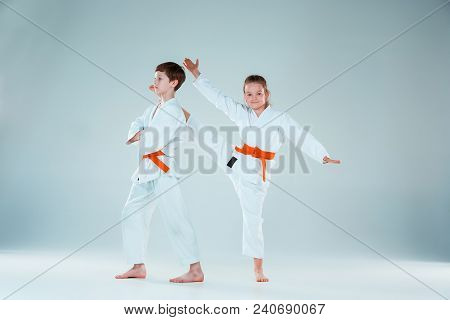 The Teen Boys And Girl At Aikido Training In Martial Arts School. Healthy Lifestyle And Sports Conce
